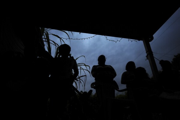 Women, who are in the U.S. illegally, and their children listen as Nora Sandigo explains their legal rights, as well as options to prepare their families in case a parent were to be detained or deported, in Homestead, Fla., Jan. 17, 2025. (AP Photo/Rebecca Blackwell, File)