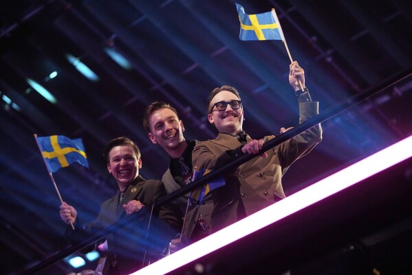 KAJ from Sweden who performed "Bara Bada Bastu" celebrate after progressing through the first semi-final to the final of the 69th Eurovision Song Contest,in Basel, Switzerland, Tuesday, May 13, 2025. (AP Photo/Martin Meissner)