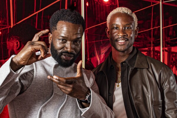 Akinola Davies Jr. left and Sope Dirisu pose for a portrait for the film 'Urchin' at the 78th international film festival, Cannes, southern France, Monday, May 19, 2025. (Photo by Joel C Ryan/Invision/AP)