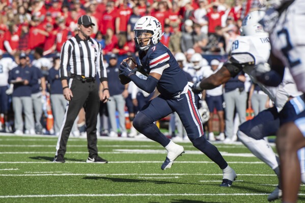 Liberty's Kaidon Salter looks to pass against Old Dominion during the first half of an NCAA college football game, Saturday, Nov. 11, 2023, in Lynchburg, Va. (AP Photo/Robert Simmons)