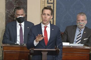 In this image from video, Sen. Josh Hawley, R-Mo., speaks as the Senate reconvenes to debate the objection to confirm the Electoral College Vote from Arizona, after protesters stormed into the U.S. Capitol on Wednesday, Jan. 6, 2021. (Senate Television via AP)