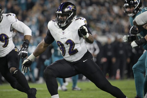 FILE - Baltimore Ravens defensive tackle Justin Madubuike (92) follows a play during the second half of an NFL football game against the Jacksonville Jaguars, Sunday, Dec. 17, 2023, in Jacksonville, Fla. Madubuike had more sacks last season (13) than his first three seasons combined. His breakout season will land him a significant deal, and perhaps a franchise tag. (AP Photo/Phelan M. Ebenhack, File)