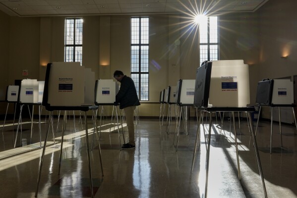 FILE - A voter fills out their Ohio primary election ballot at a polling location in Knox Presbyterian Church in Cincinnati, Ohio, on Tuesday, March 19, 2024. (AP Photo/Carolyn Kaster, File)