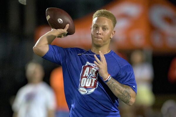 FILE - South Carolina quarterback Spencer Rattler throws at the Manning Passing Academy on the Nicholls State University campus in Thibodaux, La., June 24, 2022. In the offseason, one-time Oklahoma Heisman Trophy contender Rattler transferred to the University of South Carolina, one of several additions expected to add punch to the team. (AP Photo/Matthew Hinton, File)