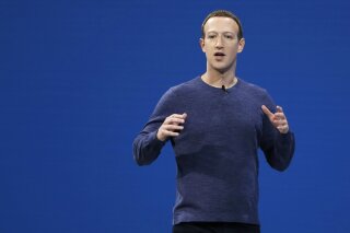 FILE - In this May 1, 2018, file photo, Facebook CEO Mark Zuckerberg makes the keynote speech at F8, Facebook's developer conference, in San Jose, Calif. Zuckerberg says the company is evaluating how it should handle “deepfake” videos created with artificial intelligence and high-tech tools to yield false but realistic clips. He said in an interview Wednesday, June 26, 2019 that it may make sense to treat such videos differently from other misinformation such as false news. Facebook has long held that it should not decide what is and isn’t true, leaving such calls instead to outside fact-checkers. (AP Photo/Marcio Jose Sanchez, File)