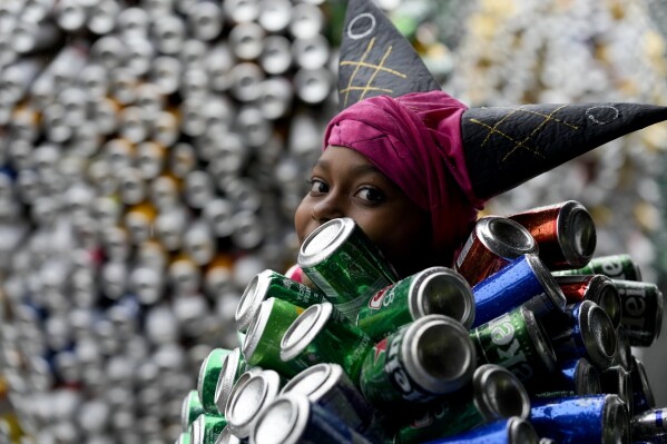 A tourist and a participant in Brazil's Carnival - Los Angeles Times