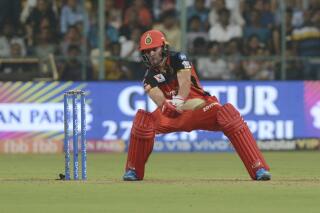 FILE - AB De Villiers, of Royal Challengers Bangalore, plays a shot during the VIVO IPL T20 cricket match between Royal Challengers Bangalore and Kings XI Punjab in Bangalore, India, Wednesday, April 24, 2019. AB de Villiers retired from all cricket on Friday, Nov. 19, 2021, ending a career that saw him flourish into one of his generation's most gifted batsmen in any format, whether in test matches for his country or Twenty20 games for club teams across the world.(AP Photo/Bangalore News Photos, File)