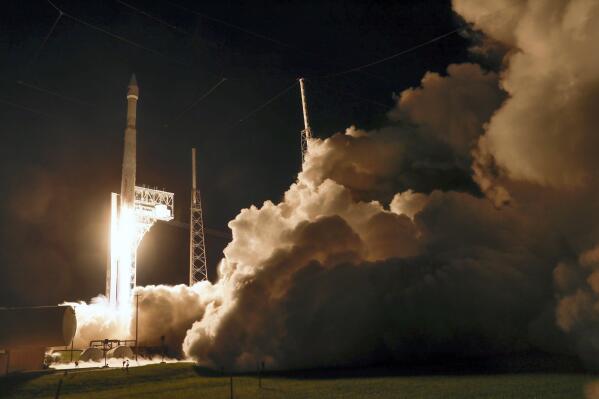 A United Launch Alliance Atlas V rocket carrying the LUCY spacecraft lifts off from Launch Complex 41 at the Cape Canaveral Space Force Station, Saturday, Oct. 16, 2021, in Cape Canaveral, Fla. Lucy, will observe Trojan asteroids, a unique family of asteroids that orbit the sun in front of and behind Jupiter. (AP Photo/(John Raoux)