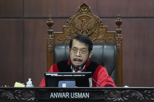 Chief Judge Anwar Usman presides over the hearing on a petition seeking to lower the minimum age of presidential and vice presidential candidates at the Constitutional Court in Jakarta, Indonesia, Monday, Oct. 16, 2023. (AP Photo/Achmad Ibrahim)