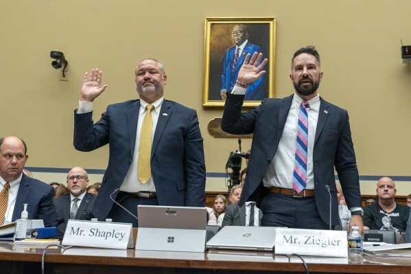 IRS Supervisory Special Agent Gary Shapley, left, and IRS Criminal Investigator Joseph Ziegler, are sworn in at a House Oversight and Accountability Committee hearing with IRS whistleblowers, Wednesday, July 19, 2023, in Washington. (AP Photo/Jacquelyn Martin)