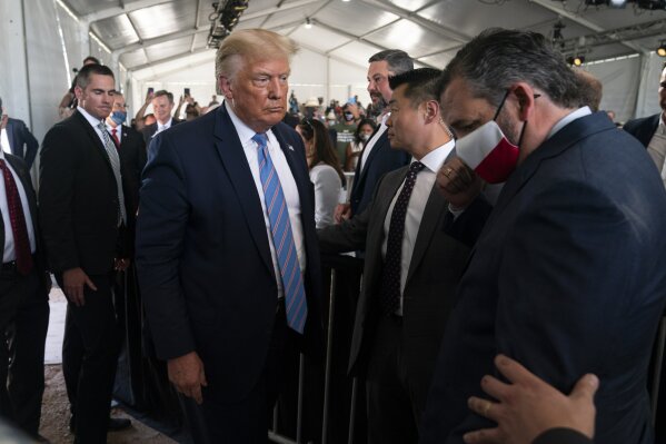 President Donald Trump leaves after delivering remarks about American energy production during a visit to the Double Eagle Energy Oil Rig, Wednesday, July 29, 2020, in Midland, Texas. Sen. Ted Cruz, R-Texas, is at right. (AP Photo/Evan Vucci)
