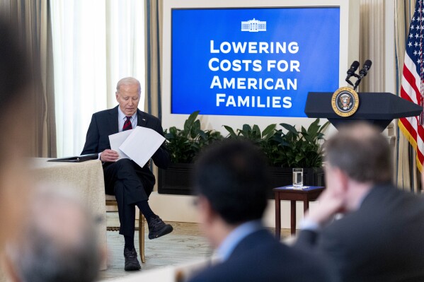 President Joe Biden sits after speaking during a meeting with his Competition Council in the State Dining Room of the White House in Washington, Tuesday, March 5, 2024. (AP Photo/Andrew Harnik)
