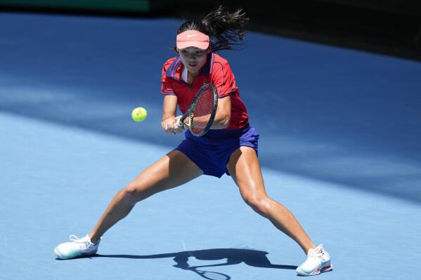Britain's Emma Raducanu makes a backhand return during a practice session on Rod Laver Arena ahead of the Australian Open tennis championships in Melbourne, Australia, Saturday, Jan. 15, 2022. (AP Photo/Simon Baker)