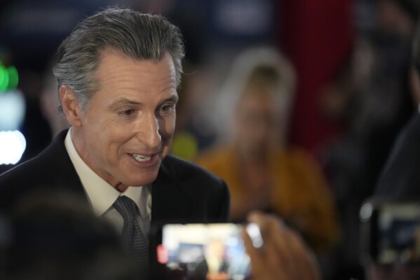 FILE - California Gov. Gavin Newsom fields questions before a Republican presidential primary debate on Sept. 27, 2023, at the Ronald Reagan Presidential Library in Simi Valley, Calif. Newsom is planning to make a stop in Israel on Friday, Oct. 20, 2023, ahead of his planned trip to China next week to discuss policies to curb global warming. (AP Photo/Marcio Jose Sanchez, File)
