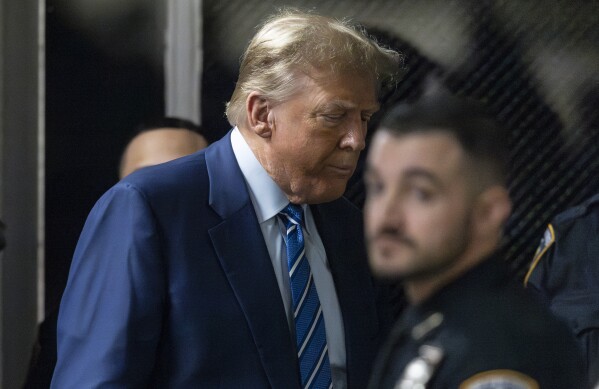 Former U.S. President Donald Trump returns to the courtroom after a short recess during the second day of his trial at Manhattan criminal court in New York, Tuesday, April 16, 2024. (Justin Lane/Pool Photo via AP)