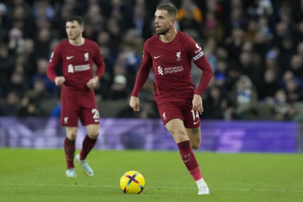 FILE - Liverpool's Jordan Henderson plays the ball during the team's English Premier League soccer match against Brighton in Brighton, England, Jan. 14, 2023. Henderson was a notable absentee as Liverpool beat Karlsruher 4-2 in a preseason friendly Wednesday, July 19, as the England midfielder closes in on a move to Saudi Arabian team Al-Ettifaq. Liverpool has reportedly agreed in principle a deal worth 12 million pounds ($15.5 million) for its Premier League and Champions League-winning captain. (AP Photo/Frank Augstein, File)