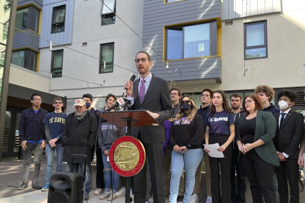 FILE - California Sen. Scott Wiener speaks about student housing during a news conference at San Francisco State University in San Francisco, Tuesday, Feb. 22, 2022. On Thursday, Sept. 7, 2023, the state Assembly voted to fast-track low-income housing on surplus land owned by nonprofit colleges and religious institutions. If the bill becomes law, it will rezone land owned by nonprofit colleges and religious institutions to allow for affordable housing and help the projects bypass local permitting and environmental review process. (AP Photo/Janie Har, File)