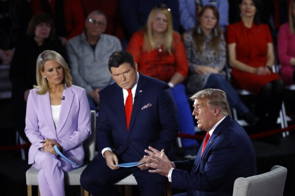 FILE - President Donald Trump speaks during a FOX News Channel Town Hall, co-moderated by FNC's chief political anchor Bret Baier of Special Report and The Story anchor Martha MacCallum, in Scranton, Pa., March 5, 2020. Former President Donald Trump's decision to back out of Fox News' first GOP primary debate this week likely costs the network a chance at a very large audience for the end of summer. Fox debate moderators Bill Baier and Martha MacCallum says Trump's exit will give other candidates the chance to shine. (AP Photo/Matt Rourke, File)
