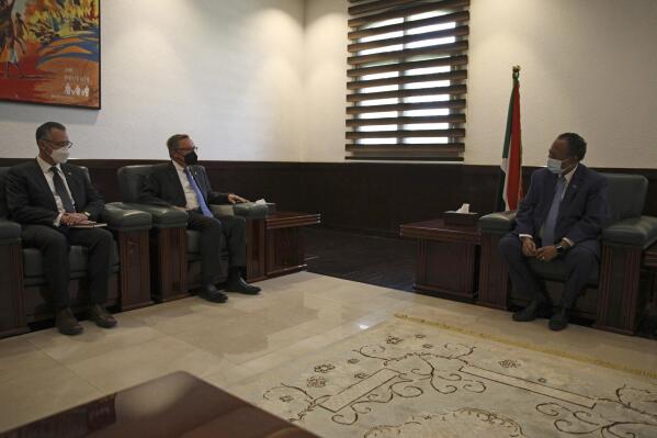Sudanese Prime Minister Abdalla Hamdok, right, meets with U.S. Special Envoy for the Horn of Africa Jeffrey Feltman, second left, in Khartoum, Sudan, Thursday, Sept. 29, 2021. (AP Photo/Marwan Ali)