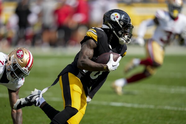 Pittsburgh Steelers wide receiver Diontae Johnson runs with the ball during the second half of an NFL football game against the San Francisco 49ers, Sunday, Sept. 10, 2023, in Pittsburgh. (AP Photo/Gene J. Puskar)