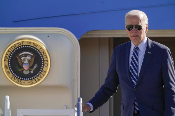 President Joe Biden pauses at the top of the stairs as he boards Air Force One at Andrews Air Force Base, Md., Thursday, Oct. 20, 2022, en route to Pennsylvania. (AP Photo/Carolyn Kaster)