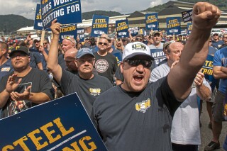 FILE - Tom Duffy of Clairton raises his fist as hundreds of United Steelworkers rally and march on Thursday, Aug. 30, 2018, in Clairton, Pa. The United Steelworkers Union has endorsed President Joe Biden Wednesday, March 20, 2024, giving him support from another large labor union. (Steph Chambers/Pittsburgh Post-Gazette via AP, File)