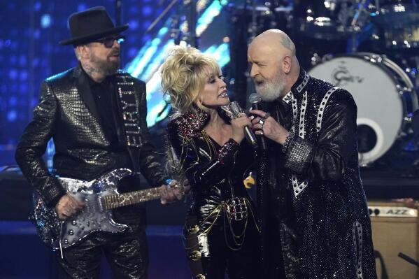 Inductees Dave Stewart of Eurythmics, from left, Dolly Parton and Rob Halford of Judas Priest perform during the Rock & Roll Hall of Fame Induction Ceremony on Saturday, Nov. 5, 2022, at the Microsoft Theater in Los Angeles. (AP Photo/Chris Pizzello)