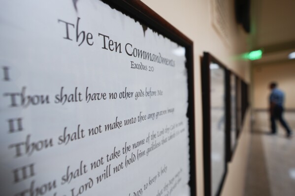 A copy of the Ten Commandments is posted along with other historical documents in a hallway at the Georgia State Capitol Building Thursday, June 20, 2024, in Atlanta. Louisiana has become the first state in the country to require the Ten Commandments are are displayed in all public schoools. (AP Photo/John Bazemore)
