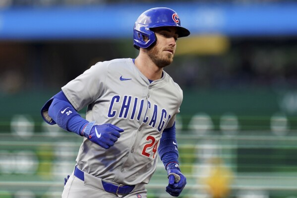 Chicago Cubs' Cody Bellinger rounds the bases after hitting a home run against the Pittsburgh Pirates during the first inning of a baseball game Friday, May 10, 2024, in Pittsburgh. (AP Photo/Matt Freed)