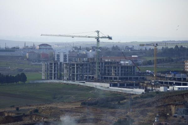 A view of the construction of buildings, part of a residential compound in Istanbul, Tuesday Dec. 8, 2022. Economic turmoil driven by inflation of 85% has plunged Turkey into one of its worst property crises. Skyrocketing prices have made finding affordable housing to rent or buy an uphill battle for many, especially for millions earning minimum wage who also struggle to cover food and energy costs. Increasing construction costs and inflation have pushed up housing prices globally. (AP Photo/Khalil Hamra)