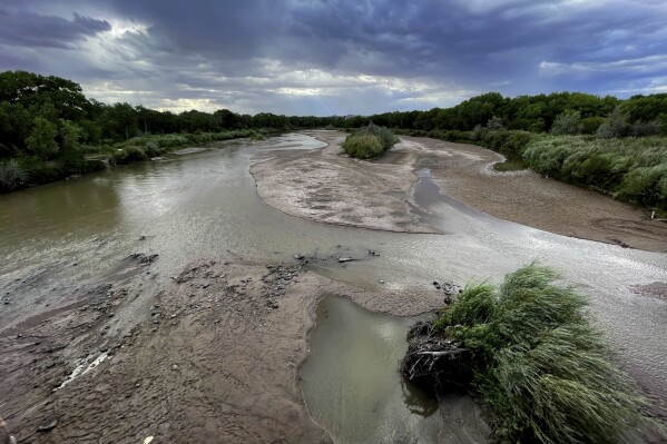 Sandbars are expanding in the Rio Grande as flows decrease through Albuquerque, N.M., on Thursday, Aug. 17, 2023. Water managers are warning than more stretches of the river near New Mexico's largest city are expected to go dry without more rain. (AP Photo/Susan Montoya Bryan)