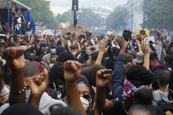 FILE - Thousands of people take part in a demonstration against police brutality and racism in Paris, France, on June 13, 2020. France’s highest administrative authority held a landmark hearing over accusations of systemic discrimination in identity checks by French police. Local grassroots organizations and international rights groups filed France’s first class-action lawsuit targeting the nation’s police force. (AP Photo/Thibault Camus, File)
