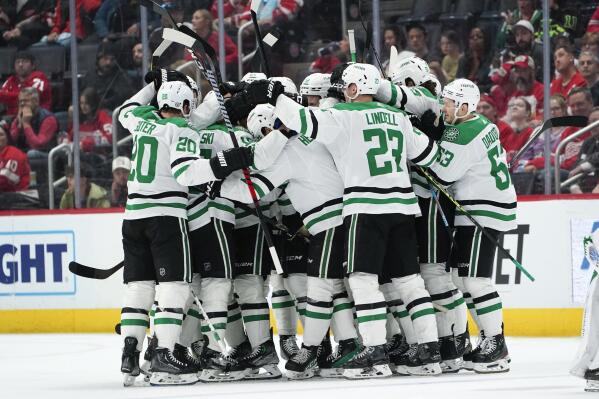 Dallas Stars center Joe Pavelski celebrates his goal against the Detroit Red Wings with teammates in the second period of an NHL hockey game Monday, April 10, 2023, in Detroit. (AP Photo/Paul Sancya)