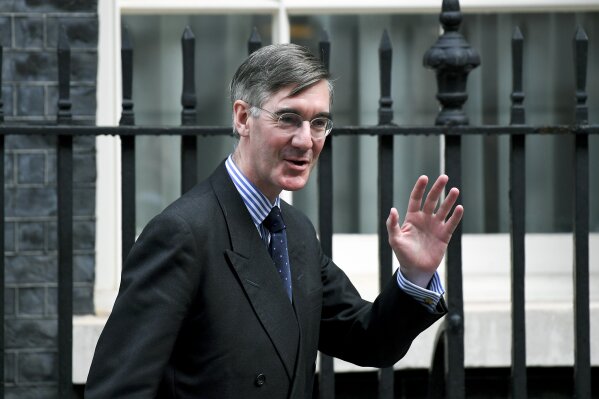 Britain's Leader of the House of Commons Jacob Rees-Mogg leaves Downing Street in London, Wednesday, Sept. 4, 2019. With Britain's prime minister weakened by a major defeat in Parliament, defiant lawmakers were moving Wednesday to bar Boris Johnson from pursuing a "no-deal" departure from the European Union. (AP Photo/Alberto Pezzali)