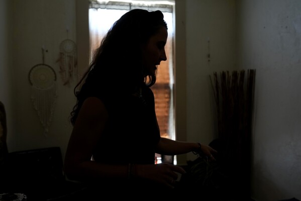 Kyleigh Thurman, one of the patients who filed a federal complaint against an emergency room for not treating her ectopic pregnancy, talks about her experience at her studio, Aug. 7, 2024, in Burnet County, Texas. (AP Photo/Eric Gay, File)