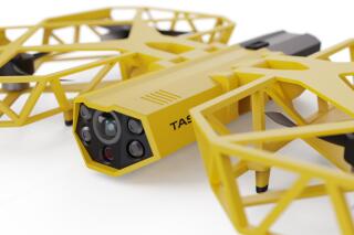This photo provided by Axon Enterprise depicts a conceptual design through a computer-generated rendering of a taser drone. Taser developer Axon says it is working to build drones armed with the electric stunning weapons that could fly in schools and “help prevent the next Uvalde, Sandy Hook, or Columbine.” But its own technology advisers quickly panned the idea as a dangerous fantasy.  (Axon Enterprise, Inc. via AP)