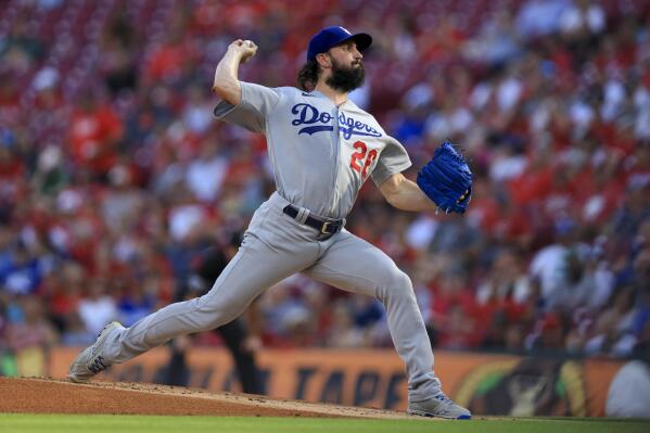 Los Angeles Dodgers' Tony Gonsolin throws during the first inning of a baseball game against the Cincinnati Reds in Cincinnati, Tuesday, June 21, 2022. (AP Photo/Aaron Doster)