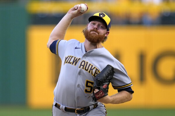 FILE - Milwaukee Brewers starting pitcher Brandon Woodruff delivers during the first inning of a baseball game against the Pittsburgh Pirates in Pittsburgh, Sept. 5, 2023. Woodruff was not tendered a contract by the Brewers by the Friday, Nov. 17, 2023, deadline, making the two-time All-Star right-handed pitcher a free agent as he recovers from surgery to his throwing shoulder. (AP Photo/Gene J. Puskar, File)