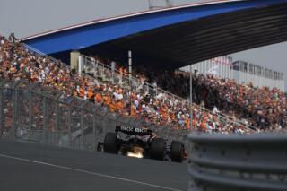 Mclaren driver Daniel Ricciardo of Australia steers his car during the first practice session ahead of Sunday's Formula One Dutch Grand Prix auto race, at the Zandvoort racetrack, in Zandvoort, Netherlands, Friday, Sept. 2, 2022. (AP Photo/Peter Dejong)