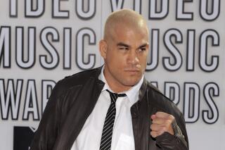 FILE - In this Sept. 12, 2010, file photo, Tito Ortiz arrives at the MTV Video Music Awards in Los Angeles. Former mixed martial arts fighter Tito Ortiz has resigned from his post the City Council of Huntington Beach, Calif., over what he has called attacks by the media. Ortiz was the city's mayor pro tem and announced his resignation on Tuesday, June 1, 2021. (AP Photo/Chris Pizzello, File)