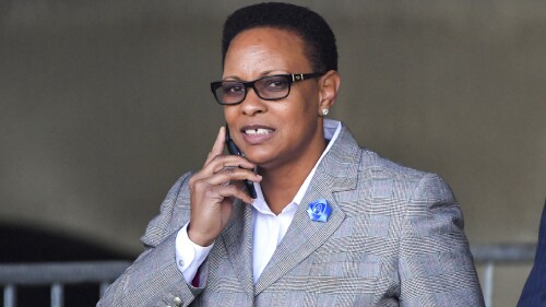 FILE - Rev. Mitzi Bickers walks at the Richard B. Russell Federal Building after her first appearance in federal court, April 5, 2018, in Atlanta. Federal prosecutors plan to ask a judge to dismiss convictions for wire fraud and to resentence Bickers, a former high-ranking Atlanta city official, who is currently serving a 14-year prison sentence stemming from an investigation into corruption at City Hall, according to a court filing Friday, June 23, 2023. (Hyosub Shin/Atlanta Journal Constitution via AP, File)