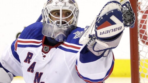 FILE - New York Rangers goalie Henrik Lundqvist, of Sweden, gloves the puck while playing against the Los Angeles Kings during the second period in Game 5 of the NHL Stanley Cup Final series in Los Angeles, June 13, 2014. Henrik Lundqvist is expected to be elected to the Hockey Hall of Fame in his first year of eligibility. (AP Photo/Jae C. Hong, File)