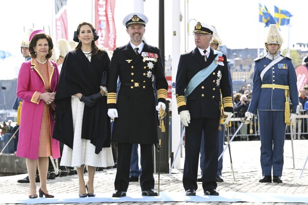 From left, Sweden's Queen Silvia, Denmark's Queen Mary, Denmark's King Frederik X and Sweden's King Carl XVI Gustaf stand, at Skeppsbron, in Stockholm, Sweden, Monday, May 6, 2024. Denmark’s King Frederik X has arrived in Stockholm, accompanied by his Australian-born wife Queen Mary, as he embarked on his first official visit abroad as new Danish monarch. (Jonas Ekströmer/TT News Agency via AP)