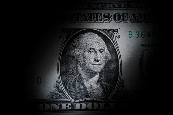 FILE - The likeness of George Washington is seen on a U.S. $1 bill, March 13, 2023, in Marple Township, Pa. (AP Photo/Matt Slocum, File)