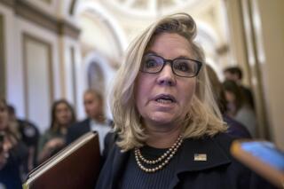 Rep. Liz Cheney, R-Wyo., vice-chair of the House committee investigating the Jan. 6, 2021, attack on the Capitol, speaks with reporters as she walks to the House chamber during final votes, at the Capitol in Washington, Friday, Sept. 30, 2022. (AP Photo/J. Scott Applewhite)