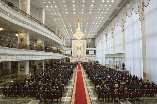 In this photo released by Belarus' Presidential Press Service, Belarusian President Alexander Lukashenko takes his oath of office during his inauguration ceremony at the Palace of the Independence in Minsk, Belarus, Tuesday, March 25, 2025. (Belarus' Presidential Press Service via AP)