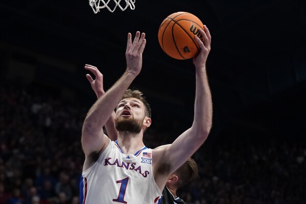Kansas center Hunter Dickinson puts up a shot during the first half of an NCAA college basketball game against Eastern Illinois Tuesday, Nov. 28, 2023, in Lawrence, Kan. (AP Photo/Charlie Riedel)