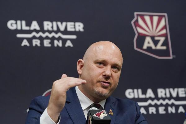 FILE - In this July 1, 2021, file photo, Arizona Coyotes new head coach Andre Tourigny speaks during an NHL hockey news conference at Gila River Arena in Glendale, Ariz. (AP Photo/Ross D. Franklin, File)