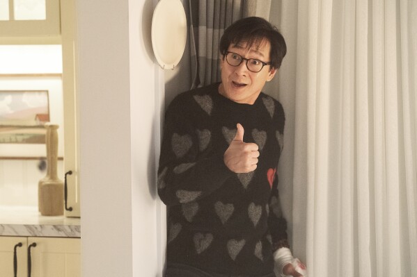 This image released by Universal Pictures shows Ke Huy Quan in a scene from "Love Hurts." (Universal Pictures via AP)