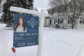 File - A "For Sale" sign stands in front of a house in Rochester, New York, on Monday, January 17, 2022. On Thursday, Freddie Mac reports on this week's average U.S. mortgage rates. (AP Photo/Ted Shaffrey, File)